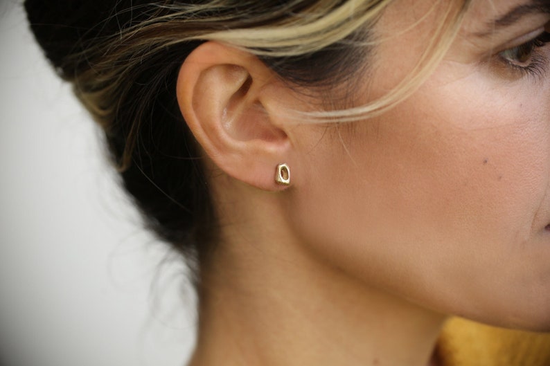 dainty organic natural 14k yellow gold tiny stud earrings by lacuna jewelry