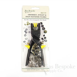 May include: A package containing a black and yellow grommet, eyelet, and snap fastener pliers tool. The package includes various metal fasteners in silver and brass tones. Text on the package reads "BEVY GROMMET, EYELET & SNAP FASTENER PLIERS".