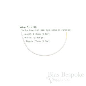 May include: A white bra underwire, size 36, with gold-coloured tips. The image includes text indicating the wire fits bra sizes 36B, 34C, 32D, 30E(DD), and 28F(DDD). Measurements are: length 210mm, width 127mm, and depth 70mm.