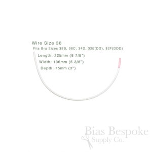 May include: A white bra underwire, size 38, with a pink-tipped end, curved in a semi-circle. The image includes text indicating the wire fits bra sizes 38B, 36C, 34D, 32E(DD), and 32F(DDD). The wire is 225mm long, 136mm wide, and 75mm deep.