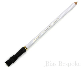 May include: White marking pencil with a black brush on one end. The pencil is labeled "Signo's Erasable Tailor's Chalk."