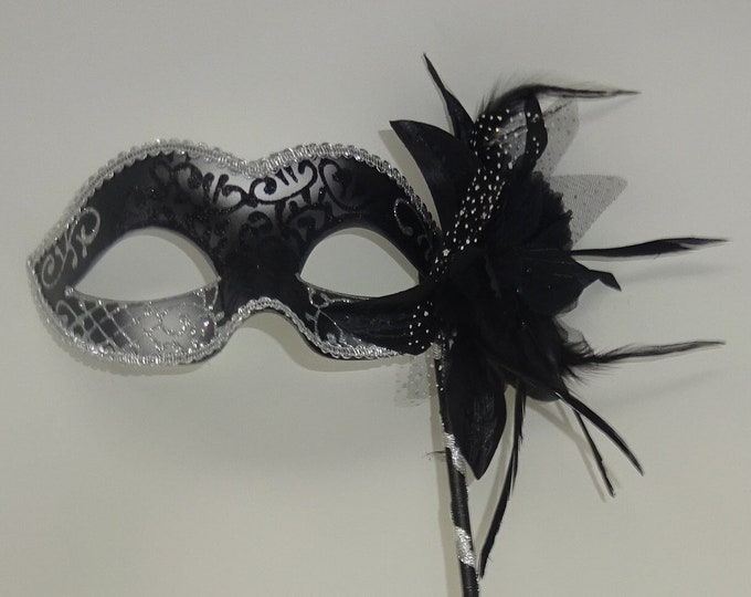 Black and Silver Rialto Masquerade Mask with Flower for Masked Ball Carnival Party Halloween Hand Held on a Wooden Stick