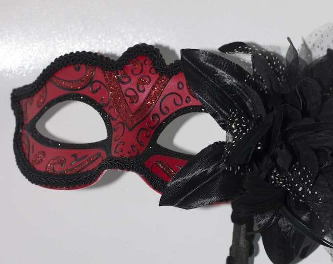 Red and Black Masquerade Mask on a Black Stick with Flower