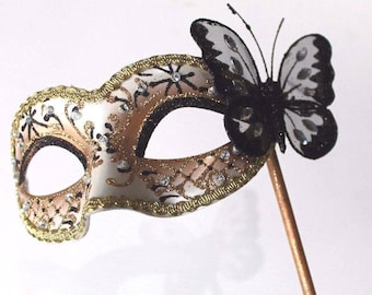 Stunning Black and Gold Masquerade Mask on a Gold Stick with Butterfly