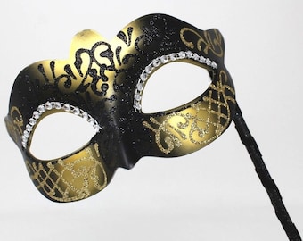 Black and Gold Masquerade Mask on a Stick