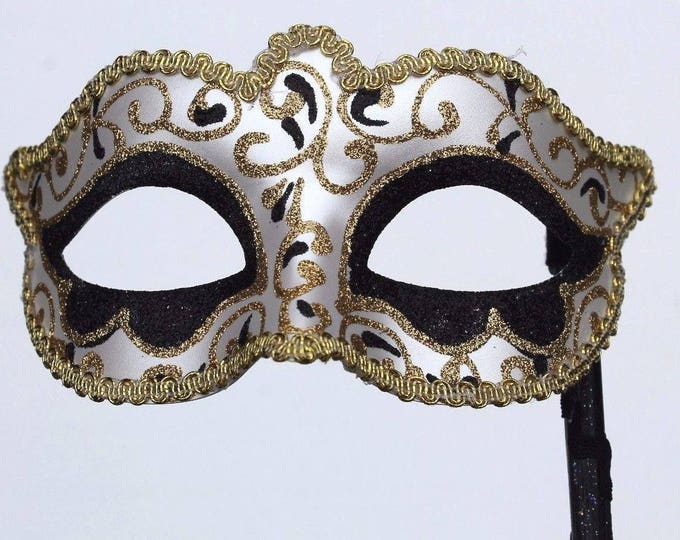 Glittering Black and Gold Masquerade Mask on a Gold Stick