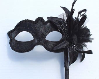 Stunning Black Masquerade Mask on a Black Stick with Black and White Flower