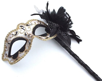 Stunning Black and Gold Flower Masquerade Mask on a Gold Stick