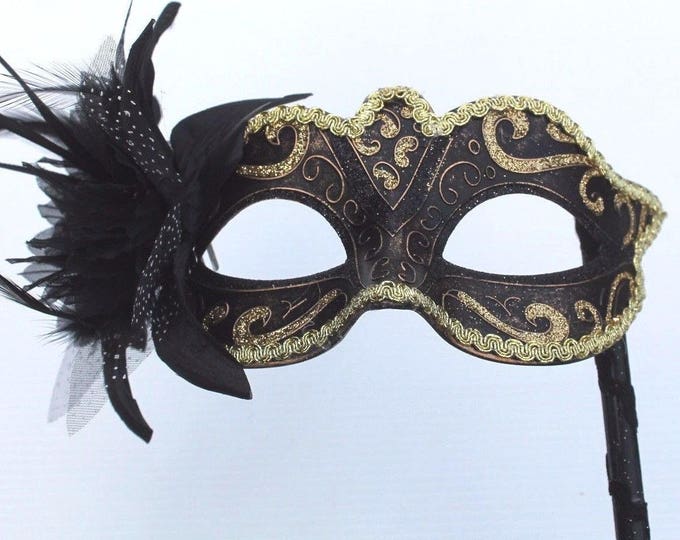 Gold and Black Masquerade Mask on a Black Stick with Flower