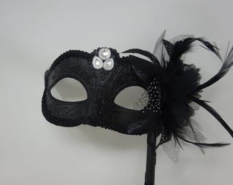 Ladies Black Jewelled Masquerade Mask on a Stick with Flower and Feathers