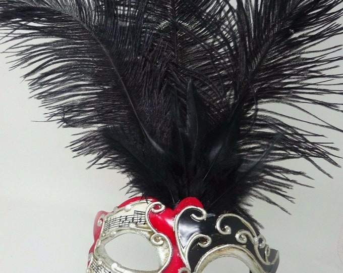 Ladies Red, Black and Silver Musical Masquerade Mask for Masked Ball with Layered Long Black Feathers Hand Held on a Wooden Stick