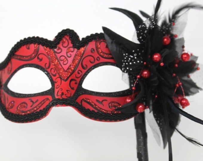 Red and Black Masquerade Mask on a Black Stick with Flower