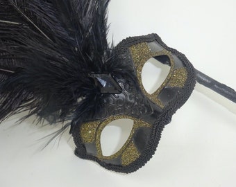 Ladies Black and Gold Masquerade Carnival Mask with Long Feathers and Centre Jewel