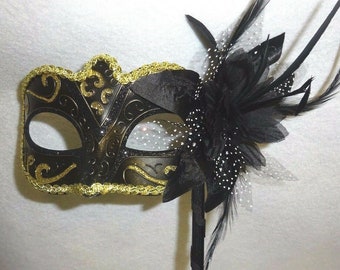 Stunning Black Bronze and Gold Masquerade Mask on a Black Stick with Flower