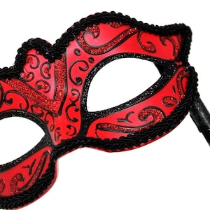 Red and Black Masquerade Mask on a Black Stick