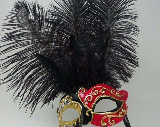 Ladies Red, Black and Gold Musical Masquerade Mask for Masked Ball with Layered Long Black Feathers Hand Held on a Wooden Stick