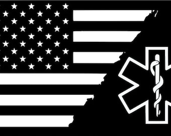 May include: Black and white American flag with a distressed edge, partially obscured by a black background. A white Star of Life medical symbol with a snake and staff is centered on the black background.