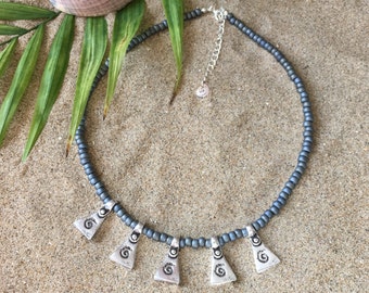 Beachcomber necklace - Necklace with metallic matte silver gray seed beads and triangle charms with wave print