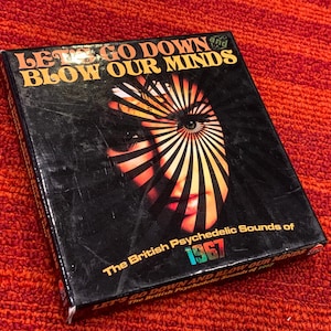 May include: A black album cover with the text "LET'S GO DOWN BLOW OUR MINDS" in gold lettering. The cover features a psychedelic design with a woman's face and the text "The British Psychedelic Sounds of 1967".