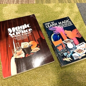 May include: Two vintage paperback books about magic. The book on the left is titled "Magic with Science" by Walter B. Gibson. The book on the right is titled "Learn Magic" by Henry Hay.