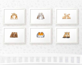May include: Set of six white picture frames with various animal illustrations. The frames are arranged in two rows of three. The illustrations include a pair of deer, a pair of owls, a pair of rabbits, a pair of bears, a pair of robins, and a pair of foxes.
