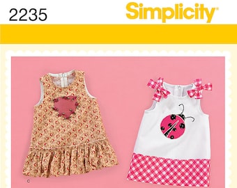SIMPLICITY 2235 Babies dress. Size XXS-L. Pattern is new and uncut.