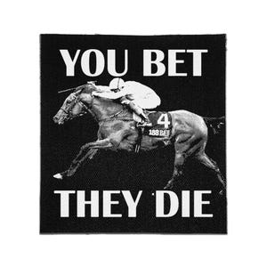 May include: A square black patch featuring a white graphic of a jockey riding a racehorse with the number 4 and the text 188BET on the saddle cloth. The text YOU BET is printed in white above the horse and THEY DIE is printed below in white.