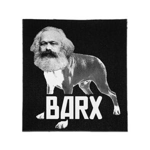 May include: A square black fabric patch featuring a white halftone graphic of a dog with the face of Karl Marx. The word BARX is printed in bold white capital letters at the bottom of the patch, centered below the dog's body.