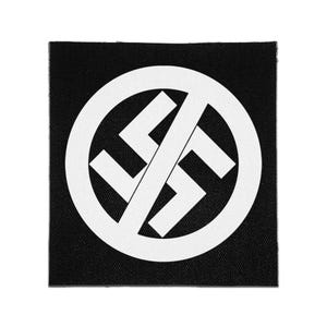 May include: A square black fabric patch featuring a white circular emblem. The design consists of a swastika symbol crossed out by a diagonal line, all rendered in a bold, high-contrast white graphic against the solid black background.