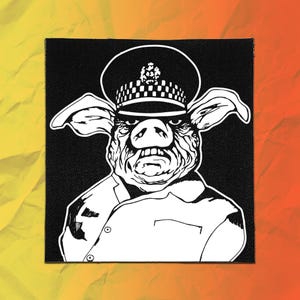 May include: A square fabric patch featuring a high-contrast black and white graphic illustration of a pig wearing a police officer's peaked cap and a uniform jacket. The design shows the pig with a stern expression, large ears, and a badge.
