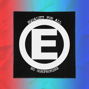 May include: A square black fabric patch featuring a white circular emblem with a large letter E in the centre. The text EQUALITY FOR ALL is printed along the top curve of the circle, and the text NO COMPROMISE is printed along the bottom curve.