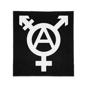 May include: A square black fabric patch featuring a white printed design. The graphic combines a central letter A inside a circle with a male symbol pointing up and right, a female symbol pointing down, and a transgender symbol pointing up and left.