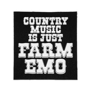 May include: A square black fabric patch featuring white embroidered text that reads: COUNTRY MUSIC IS JUST FARM EMO. The lettering is in a bold, western-style font with a distinct outline, centered on the dark, textured material of the patch.