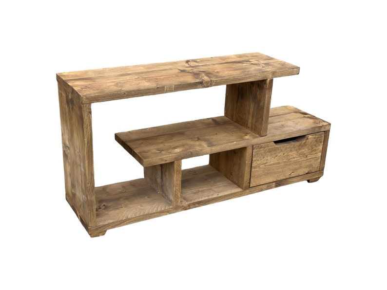 May include: Rustic wooden TV stand with open shelves and a drawer. The stand is made of reclaimed wood and has a natural finish.