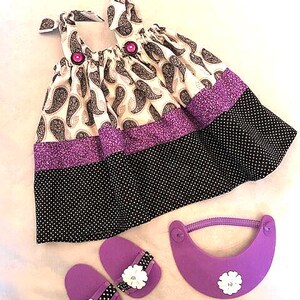 Purple, white and black paisley print sundress with visor and sandals that fits 18in American Girl dolls