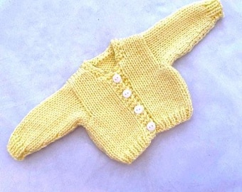 Lemon yellow handknit cardigan sweater that fits 18 inch dolls