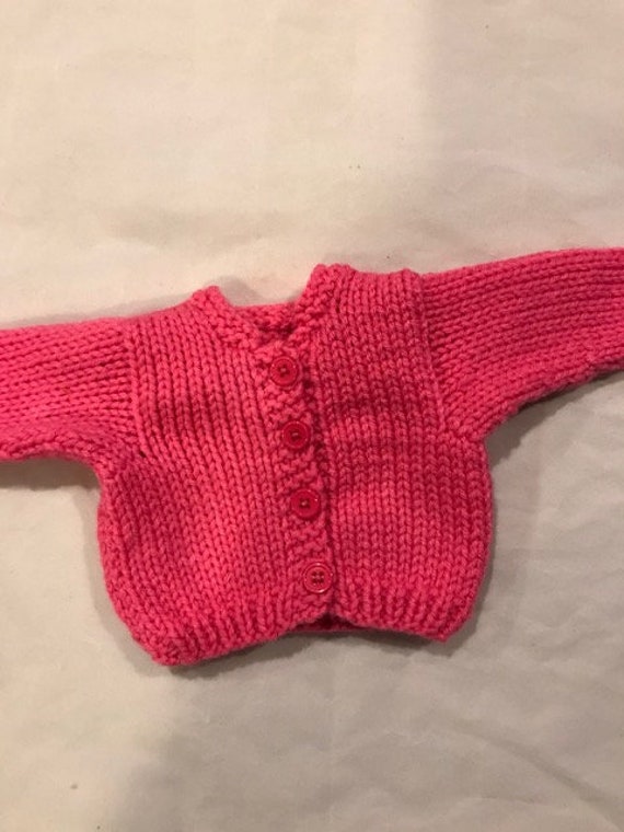 bright pink cardigan sweater