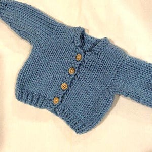 Handknit colonial blue cardigan sweater that fits 18in dolls