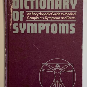 May include: A burgundy book with the title "Good Housekeeping Dictionary of Symptoms" in white and gray lettering. The book cover features a gray illustration of a human figure in a circle and square.