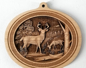May include: A wooden ornament featuring a detailed carving of a buck and a doe in a forest setting. The ornament is oval shaped and has a decorative border.