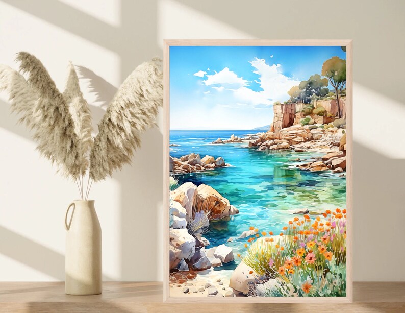 May include: A watercolor painting of a rocky coastline with turquoise water. The painting features a cliff with trees and a small beach with orange flowers.