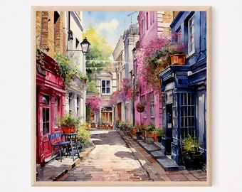 May include: A framed watercolor painting of a narrow European street scene. The composition features vibrant red, pink, and deep blue building facades adorned with potted plants and flowers, leading toward a sunlit path with stone paving.