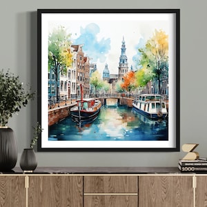 May include: Watercolor painting of a canal scene in a European city. The painting features colorful buildings, a bridge, trees, and two boats on the water.