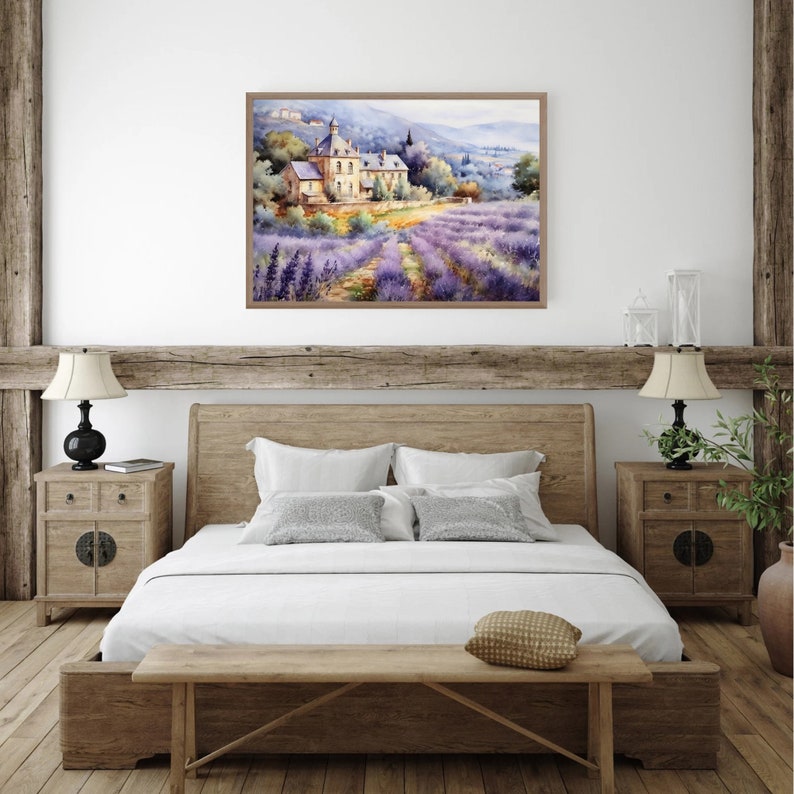 May include: A watercolor painting of a house in a field of lavender. The house is a light yellow color with a brown roof. The lavender field is a vibrant purple color. The painting is framed in a light brown frame.