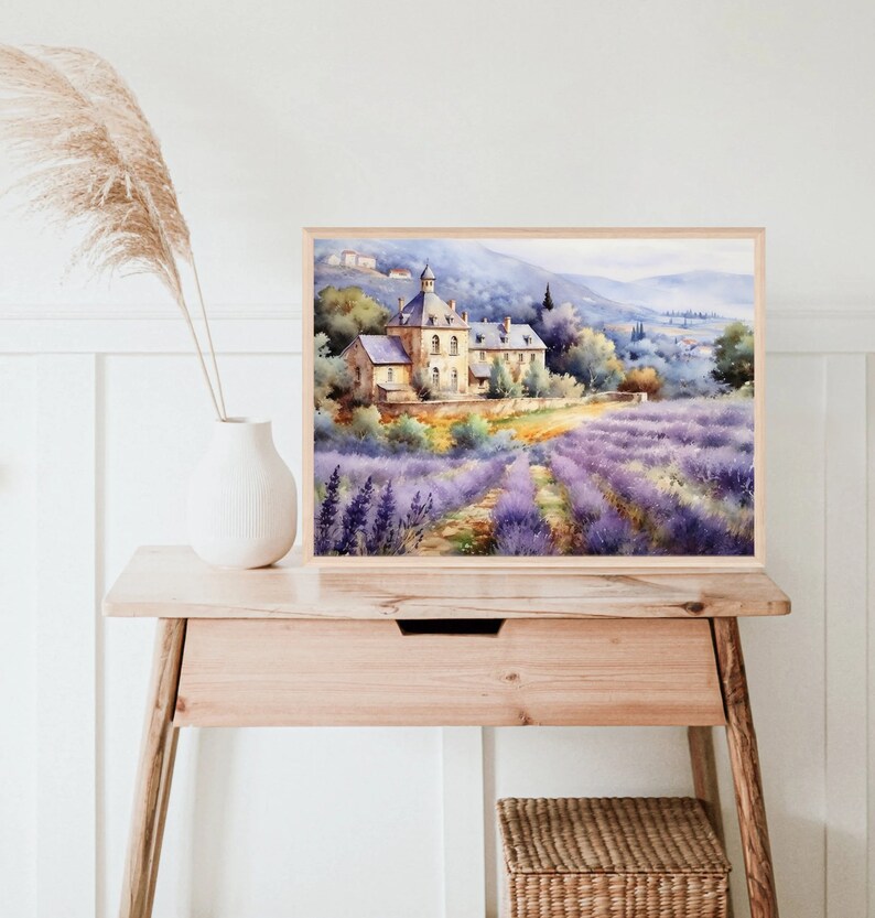 May include: A watercolor painting of a stone building with a lavender field in the foreground. The building has a pointed roof and is surrounded by trees. The lavender field is a vibrant purple and extends to the horizon.