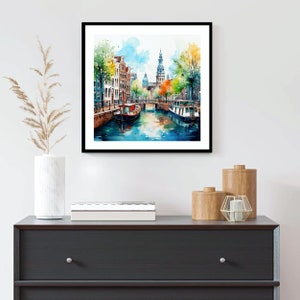 May include: Watercolor painting of a canal in Amsterdam, Netherlands. The painting features a narrow canal with buildings lining the sides, a bridge, and two boats. The buildings are painted in a variety of colors, including red, orange, yellow, and green. The canal is painted in shades of blue and green. The sky is painted in shades of blue and white.