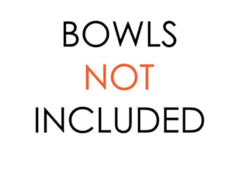 May include: Text that reads "BOWLS NOT INCLUDED" in black and orange lettering.