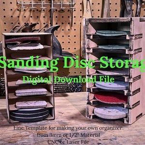 May include: Two wooden sanding disc storage units, each with multiple shelves holding various sanding discs. The text "5" Sanding Disc Storage" is displayed in green. The units are made from light-colored wood and are designed to organize sanding discs.