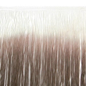 May include: White and brown ombre fringe trim. The fringe is made of a soft, silky material and is perfect for adding a touch of elegance to any project.