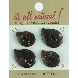 May include: Four dark brown, teardrop-shaped buttons with speckled tan inclusions, each featuring two central holes. They are mounted on a rectangular card labelled "its all natural! imagine! visualize! create!" and "HAND MADE BUTTONS" at the bottom.